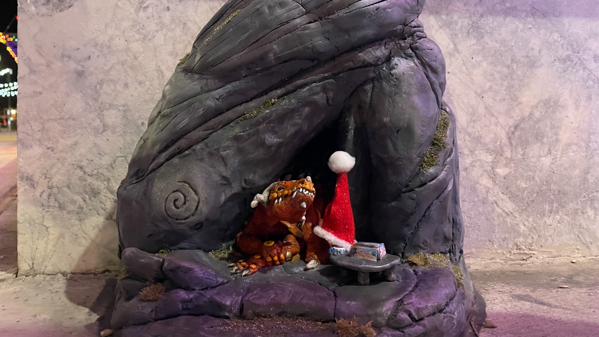 A tiny cave door with a dino