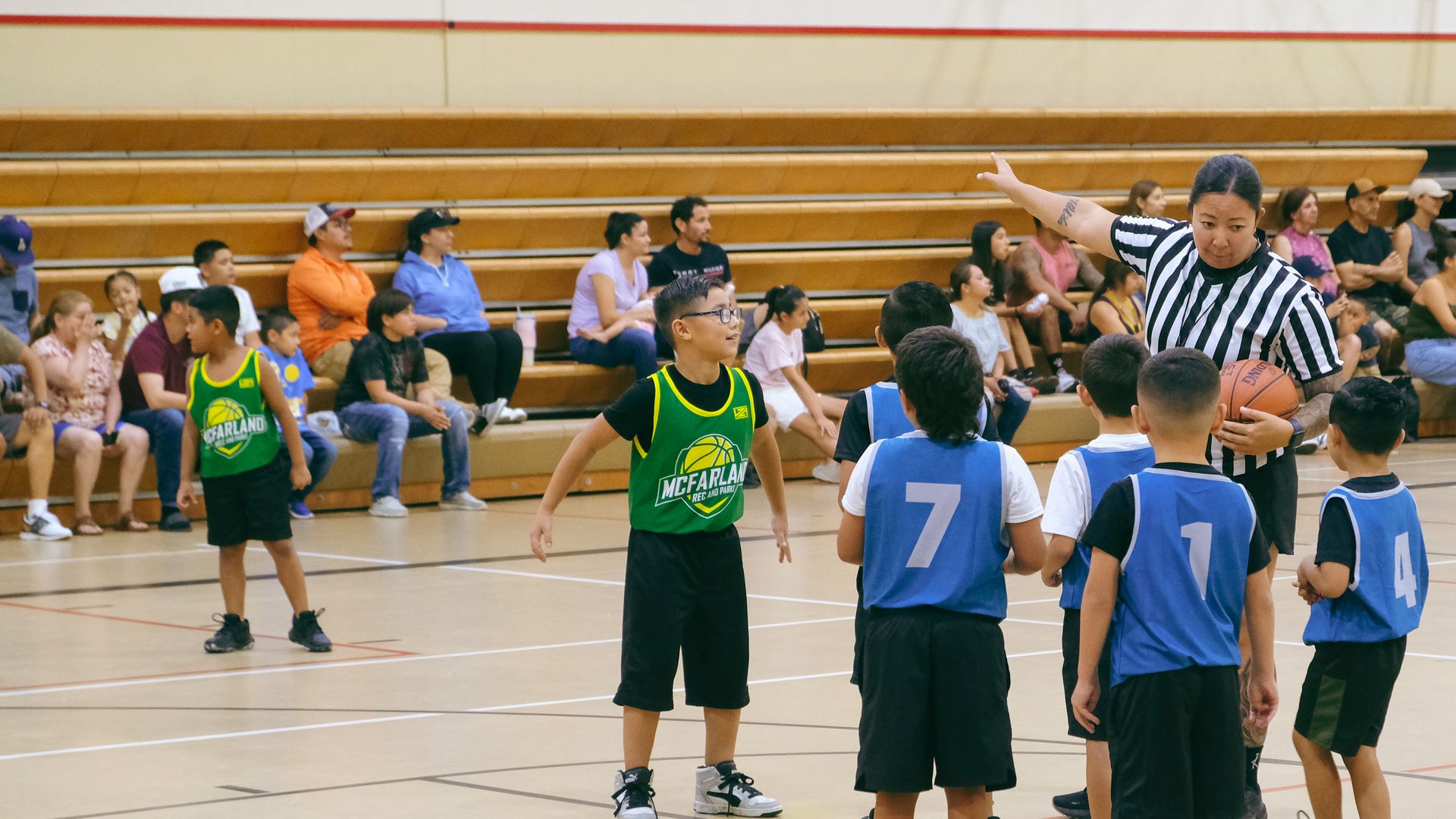 Latino children in McFarland, California, play in a basketball game on July 17, 2024.