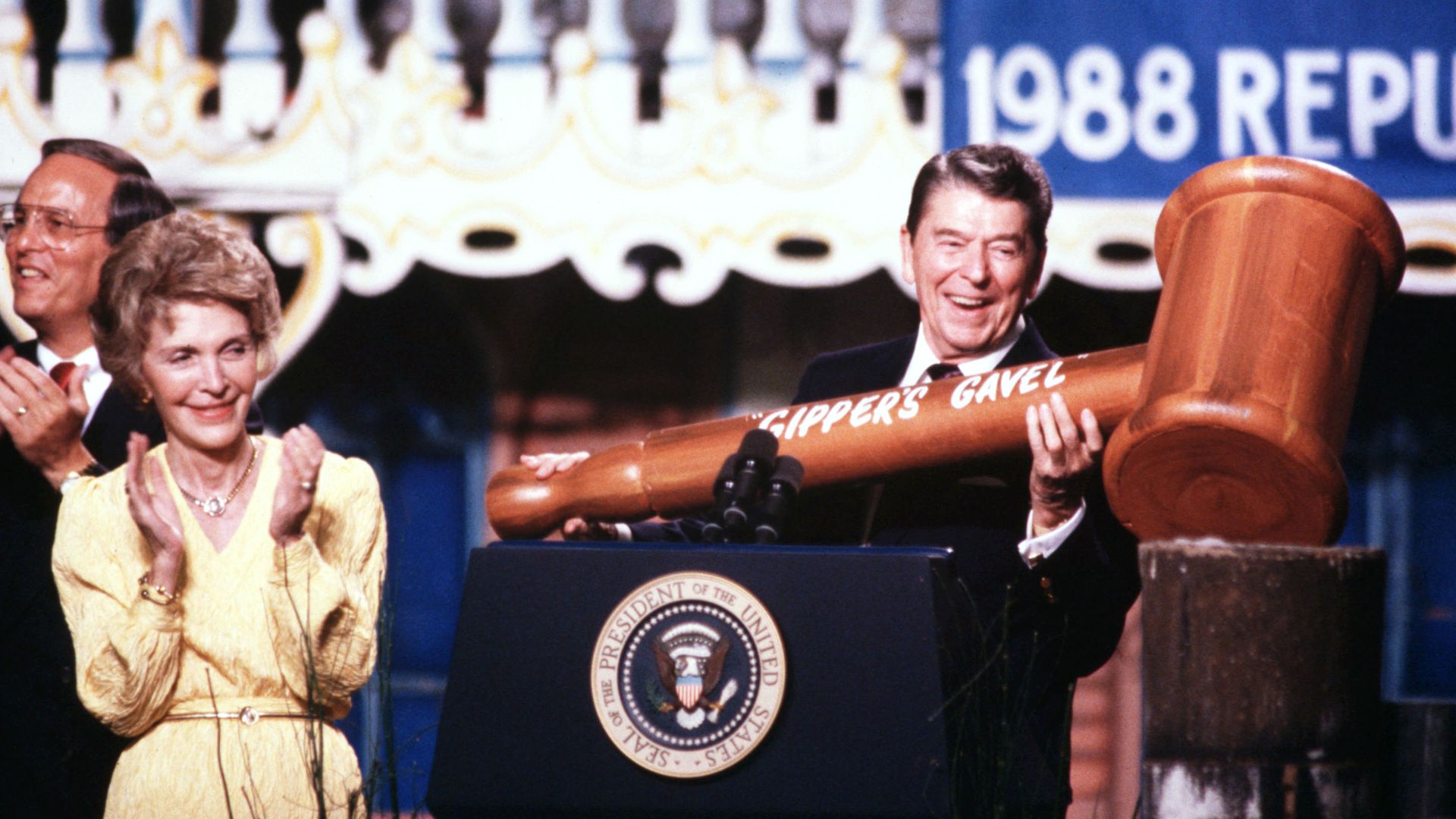 The photo shows President Ronald Reagan on stage in 1988 with a massive gavel.