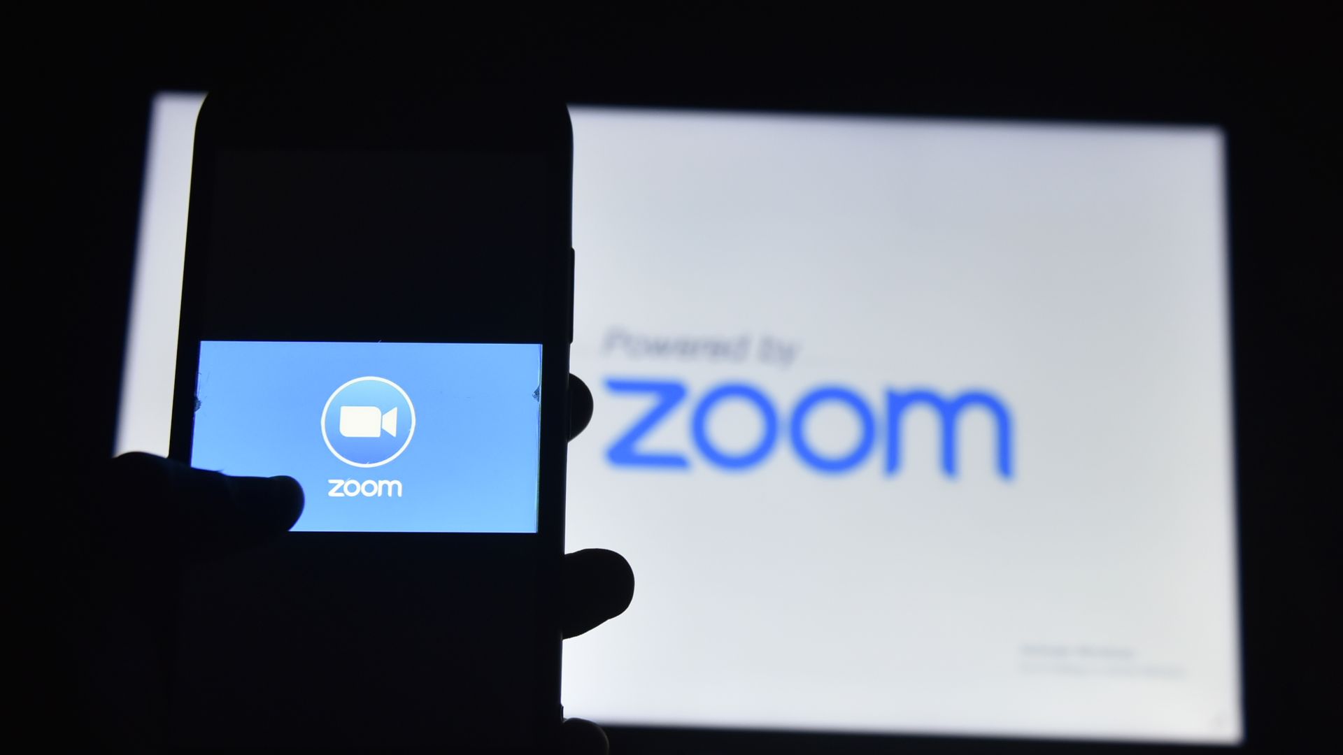 A photo illustration of the Zoom video conferencing app logo.