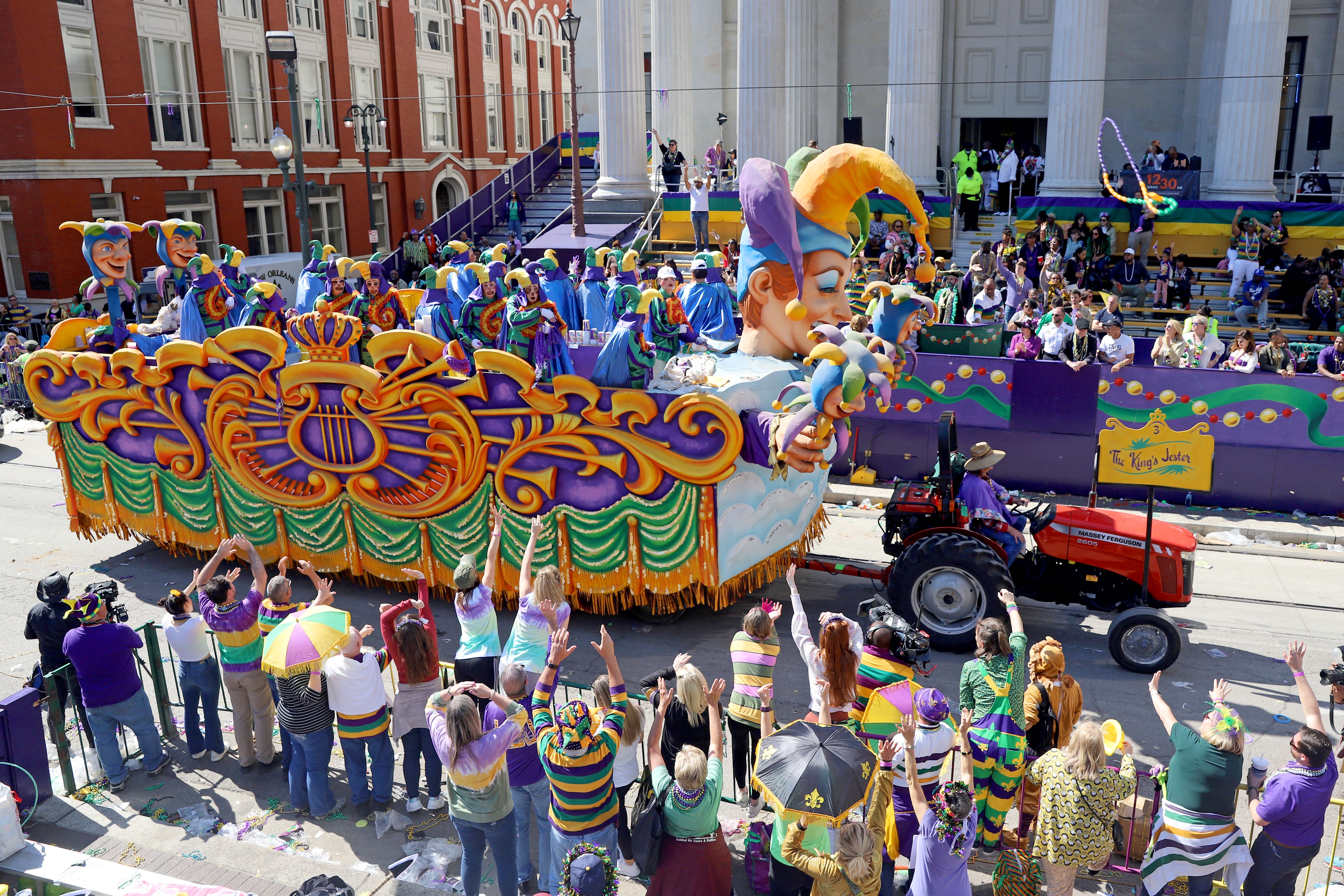 a float makes its way down the street at a Mardi Gras parade 2022