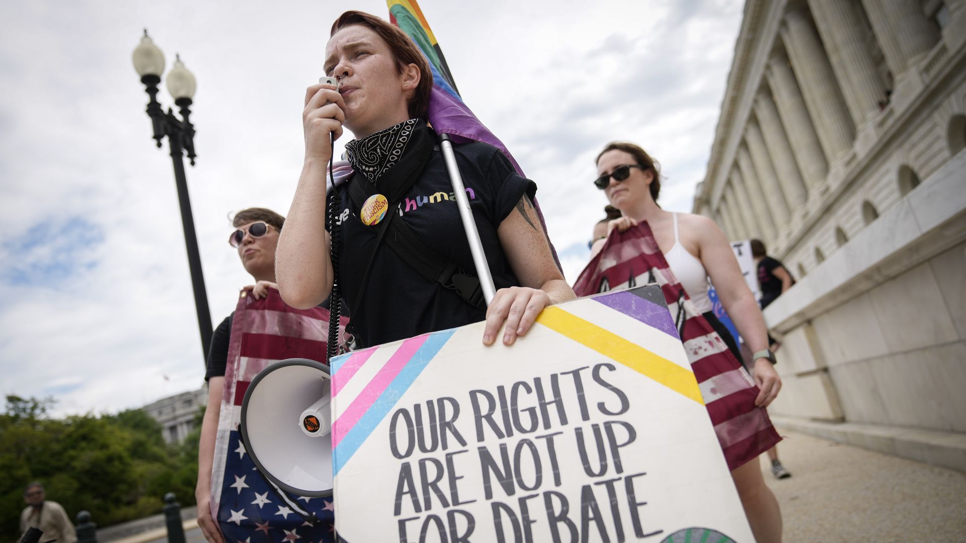 A small group of abortion rights activists march from the U.S. Supreme Court to the House of Representatives office buildings on Capitol Hill on July 6, 2022.