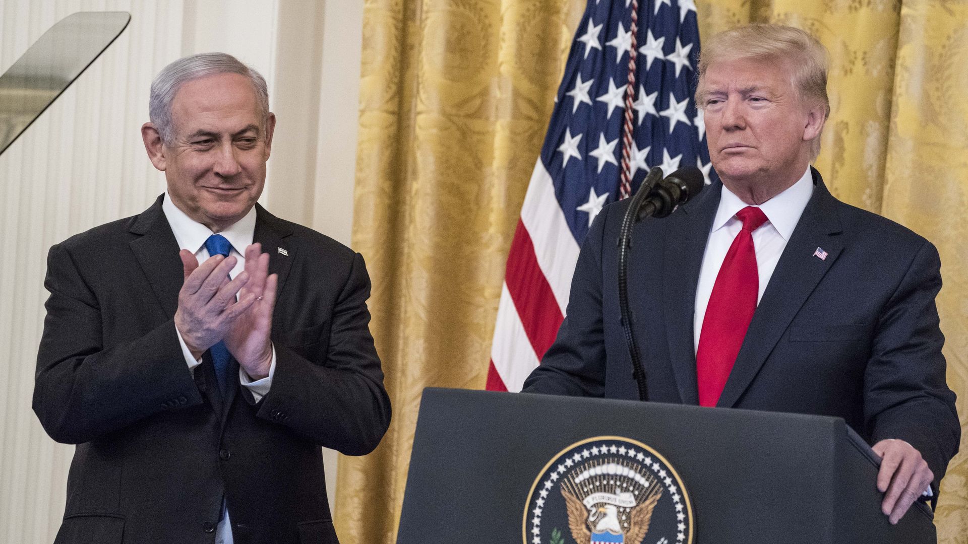 President Donald Trump and Israeli Prime Minister Benjamin Netanyahu participate in a joint statement in the East Room of the White House on January 28