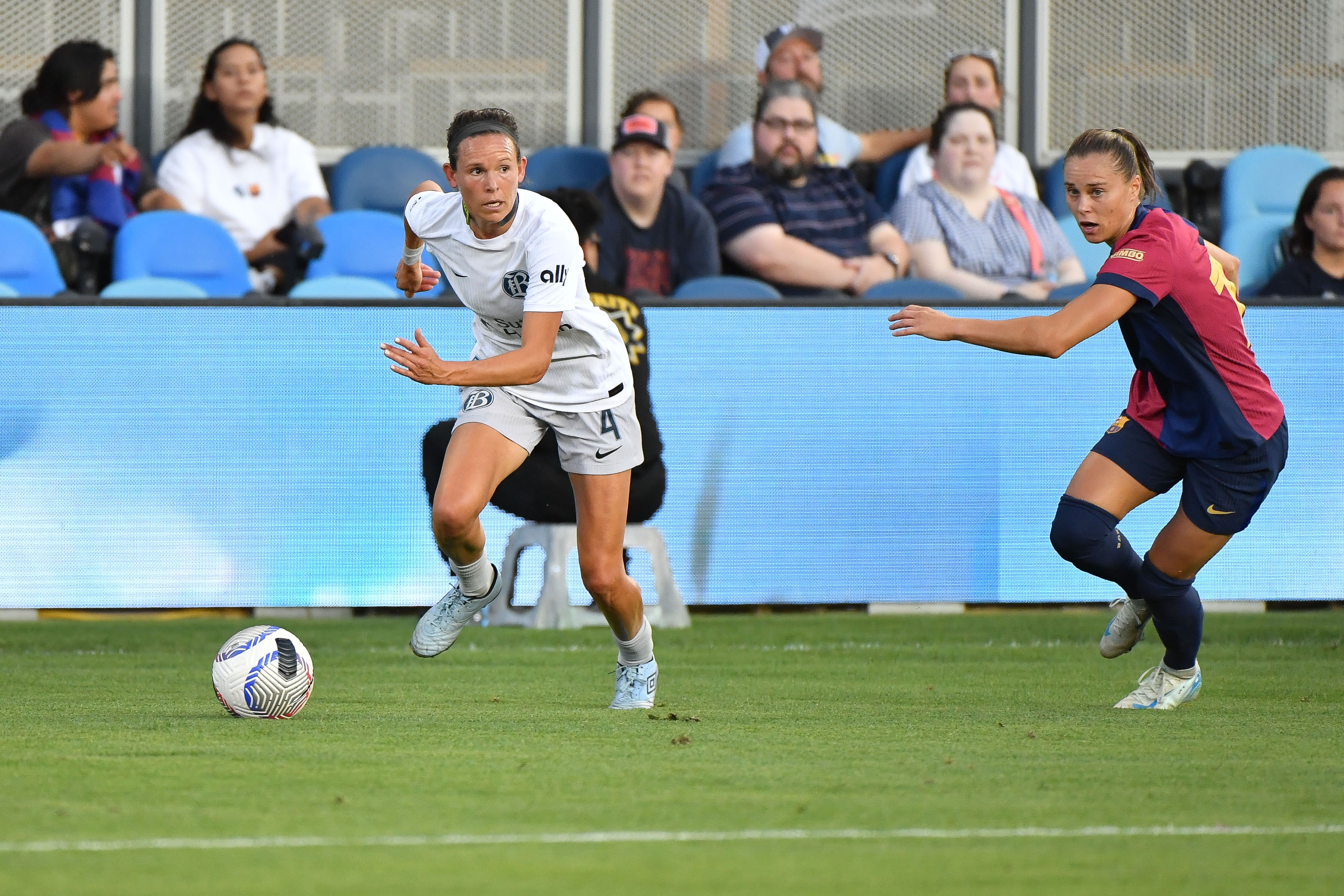 BayFC's Emily Menges dribbles the ball during a game between FC Barcelona and Bay FC 