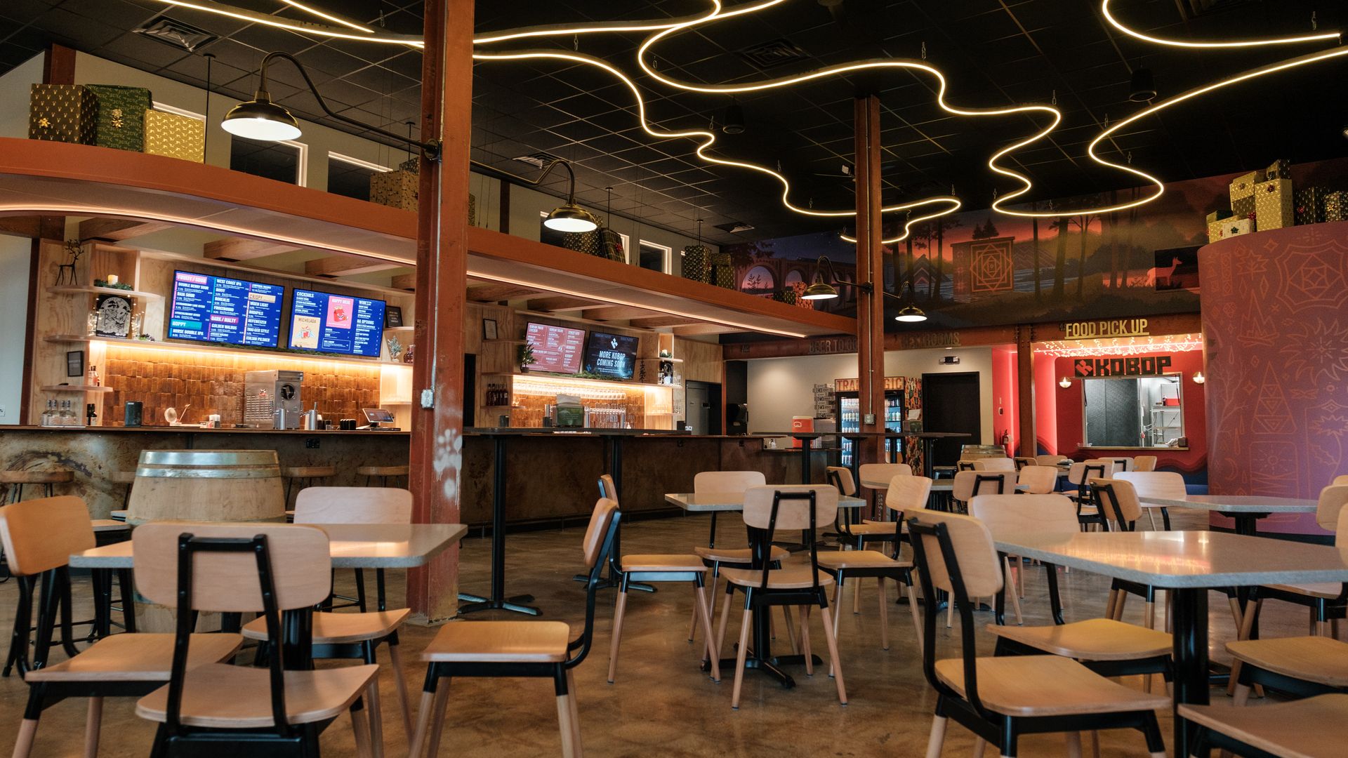 a restaurant dining room with cool lights on the ceiling 