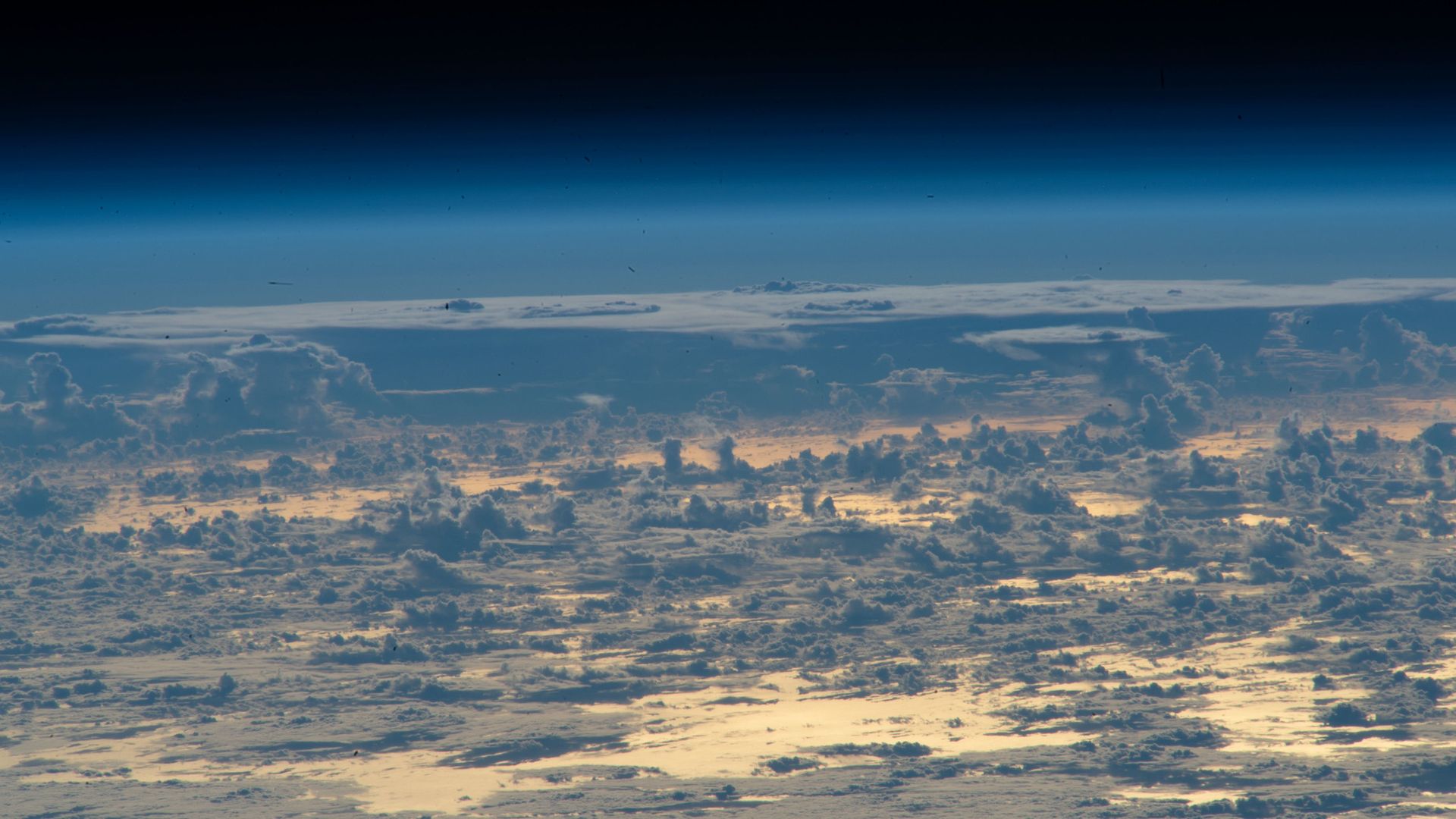 Clouds protrude above the north Atlantic Ocean.