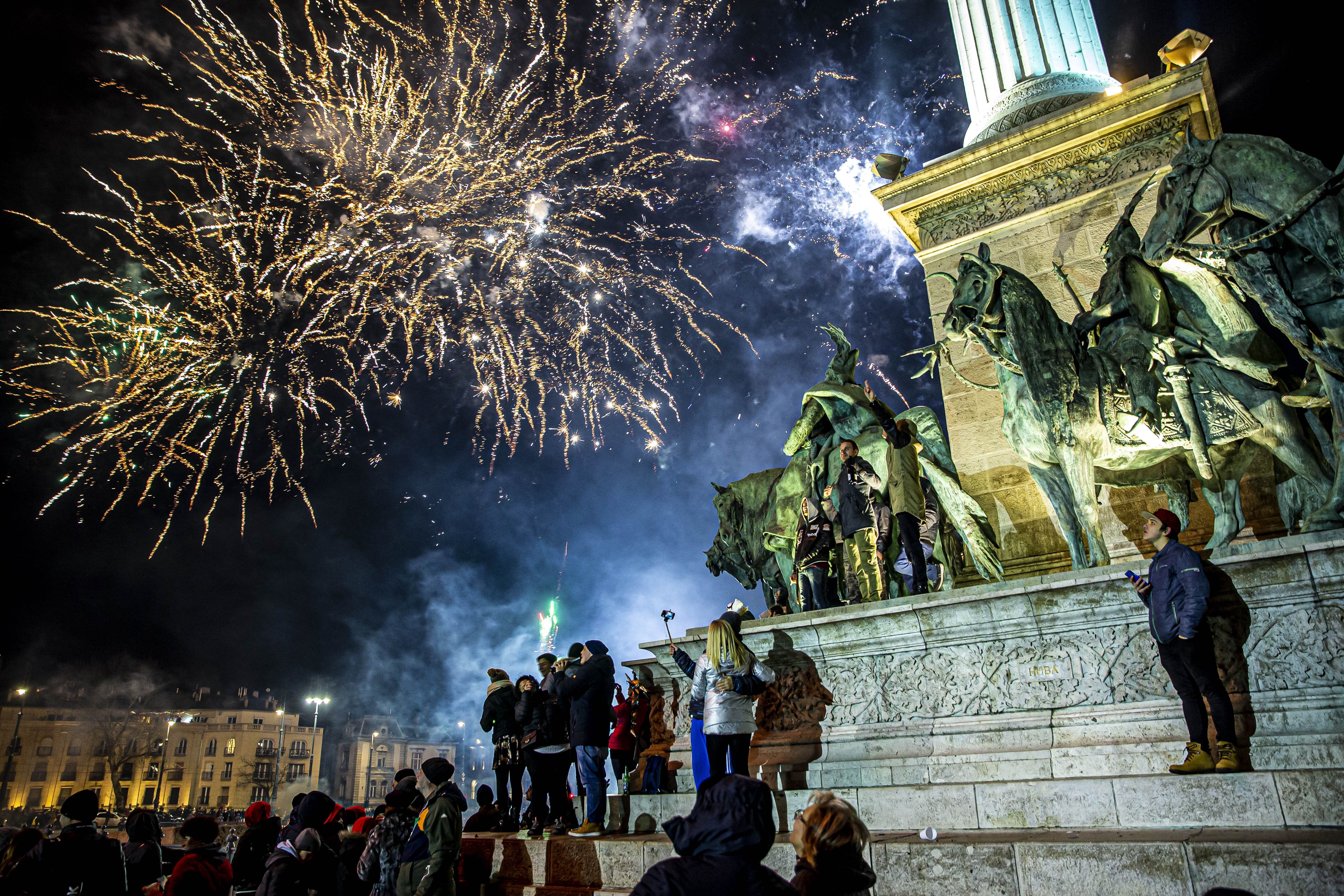 Fireworks light up the night sky over Heroes Square within the new year celebrations in Budapest, Hungary on January 01