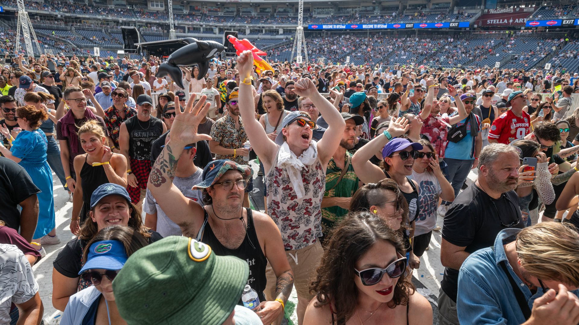 Fans dance in a crowd outside at HFStival.