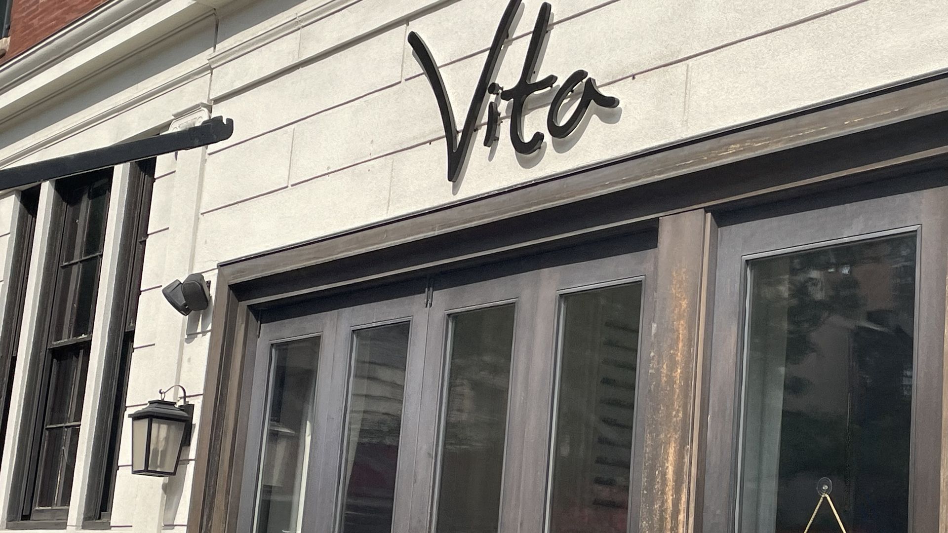 A sign that says "Vita" hanging above the Rittenhouse Square gelato shop.