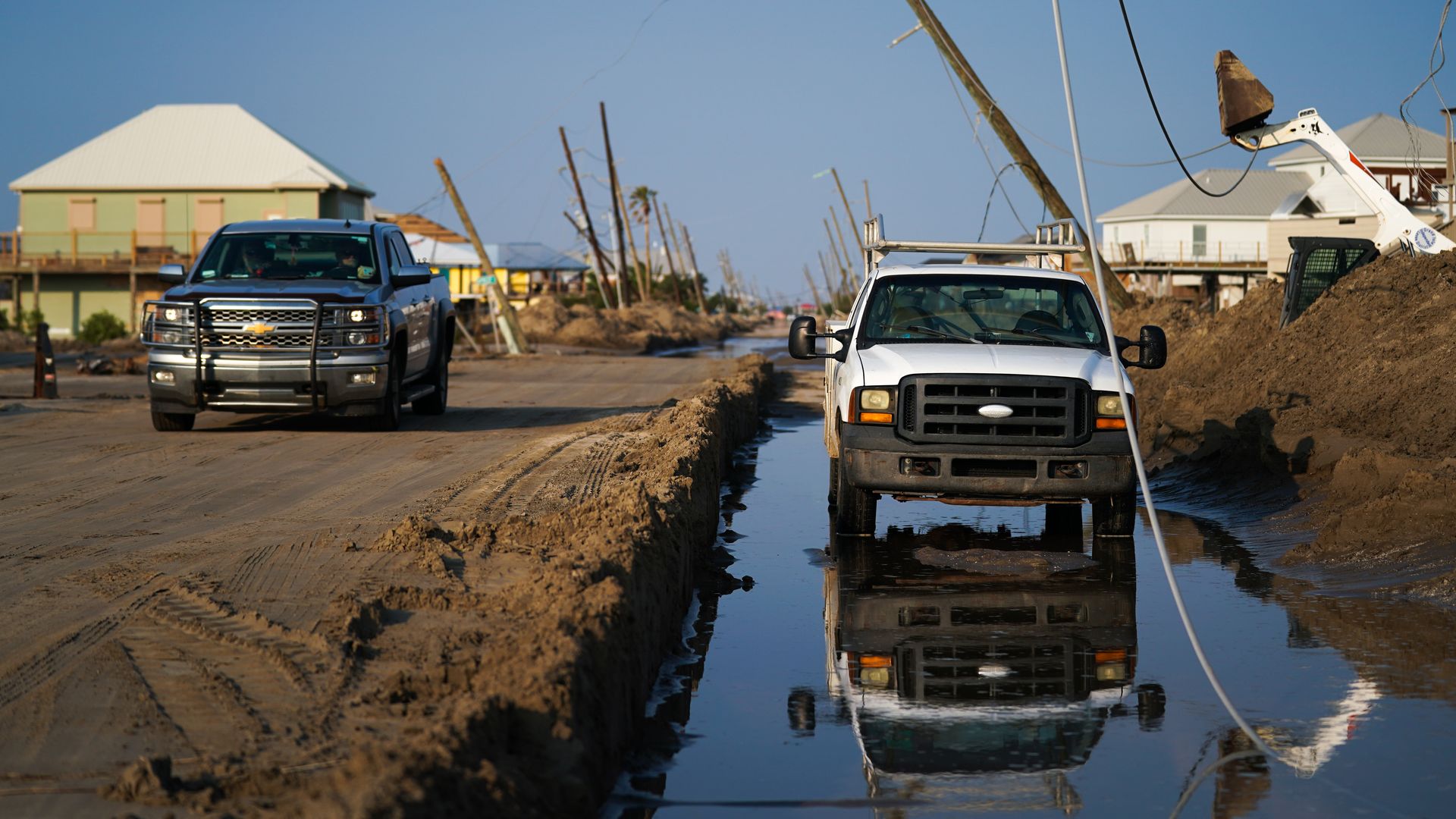 Several feet of sand covers a road in the wake of Hurricane Ida on September 4, 2021 in Grand Isle, Louisiana. 