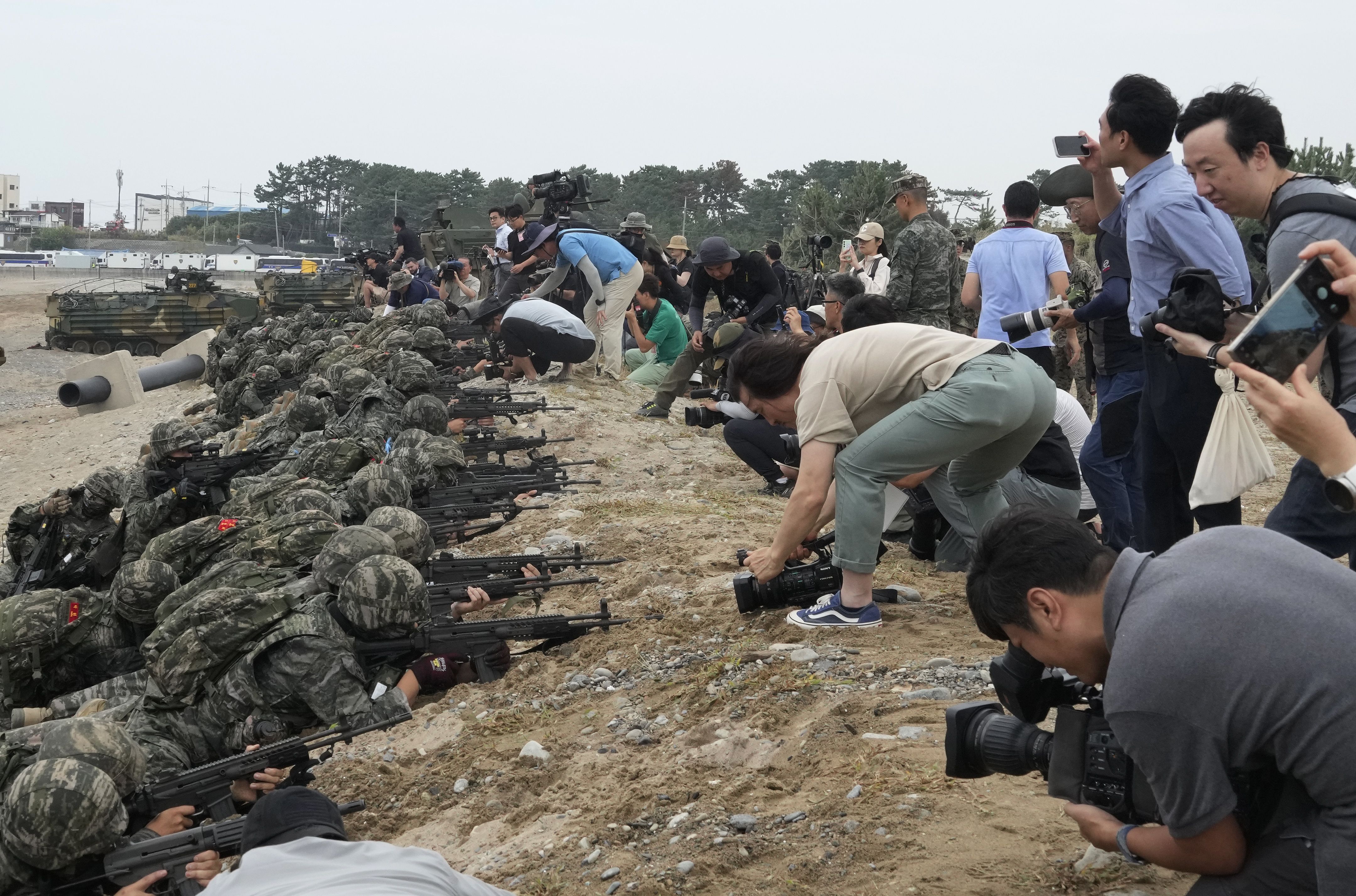 Cameras come very close to South Korean marines'  guns