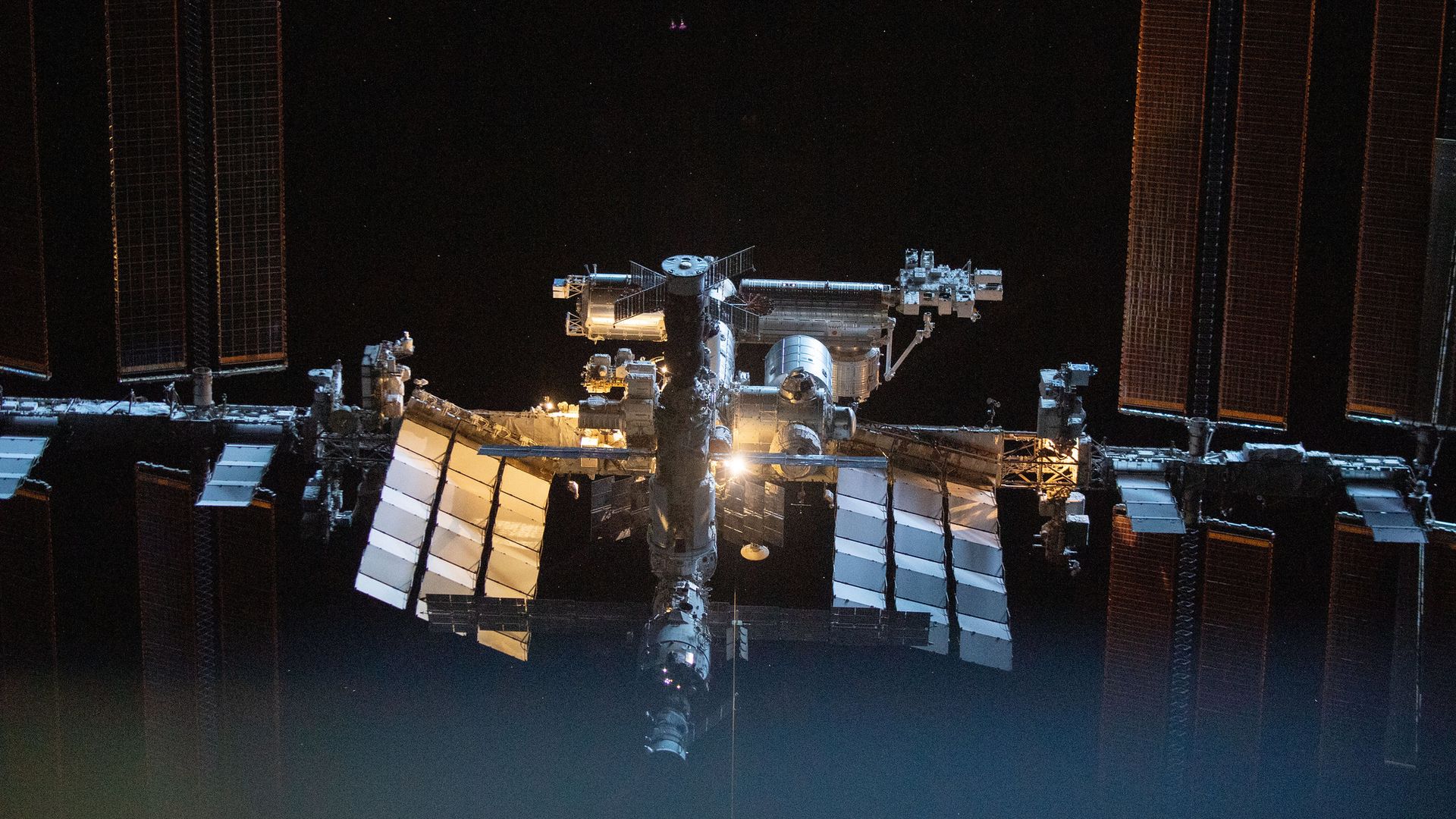 The International Space Station seen from afar in twilight