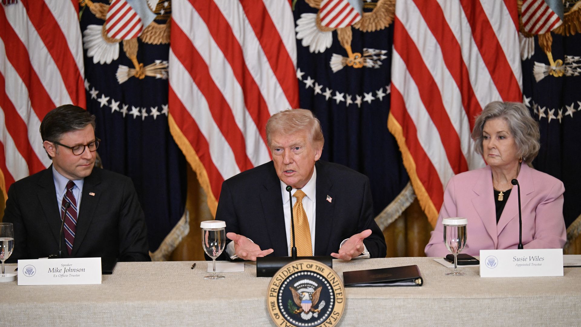 President Trump sits beside Speaker Mike Johnson during a lunch at the White House on March 16.