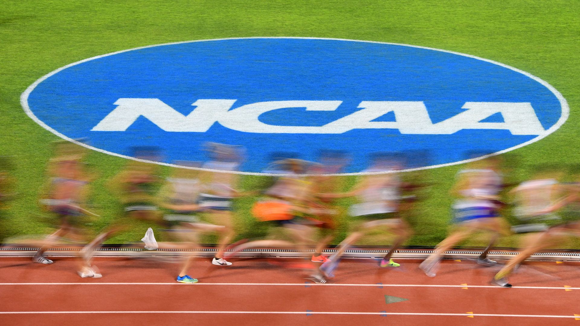 NCAA student athletes running on a track