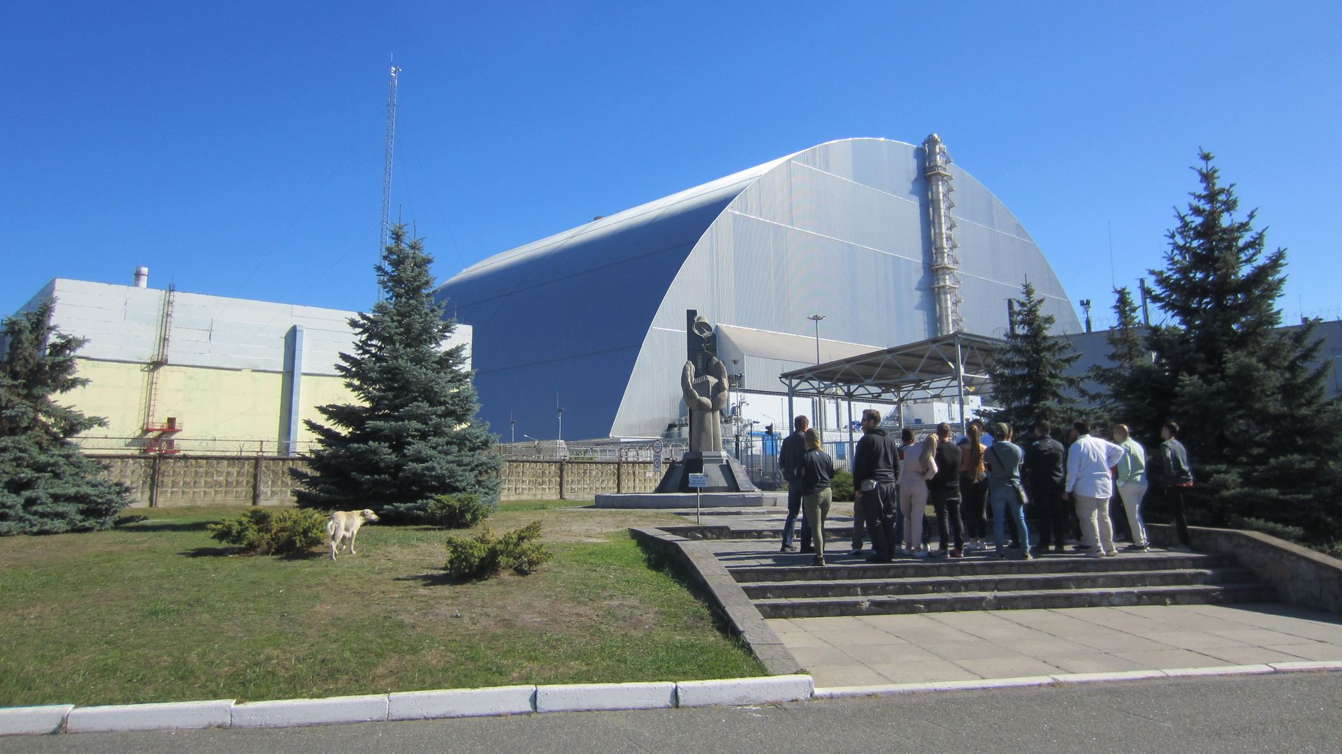 People in front of a memorial near unit four of the Chernobyl nuclear power plant in Ukraine in September 2021.