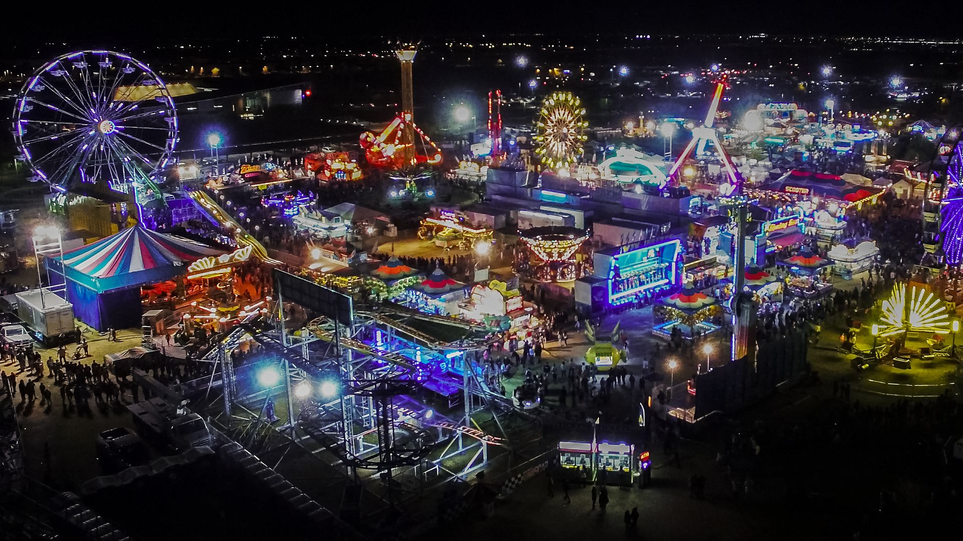 An aerial photo of a carnival at night. 