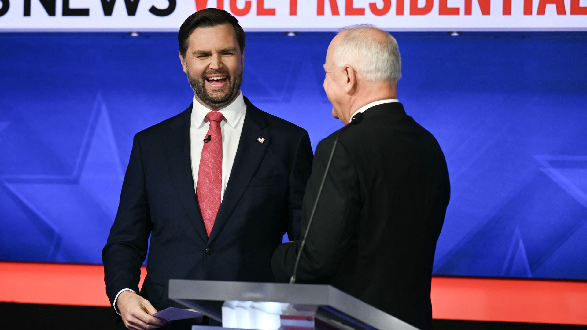 enator and Republican vice presidential candidate J.D. Vance (L) and Minnesota Governor and Democratic vice presidential candidate Tim Walz talk with each other at the end of the Vice Presidential debate hosted by CBS News at the CBS Broadcast Center in New York City on October 1, 2024