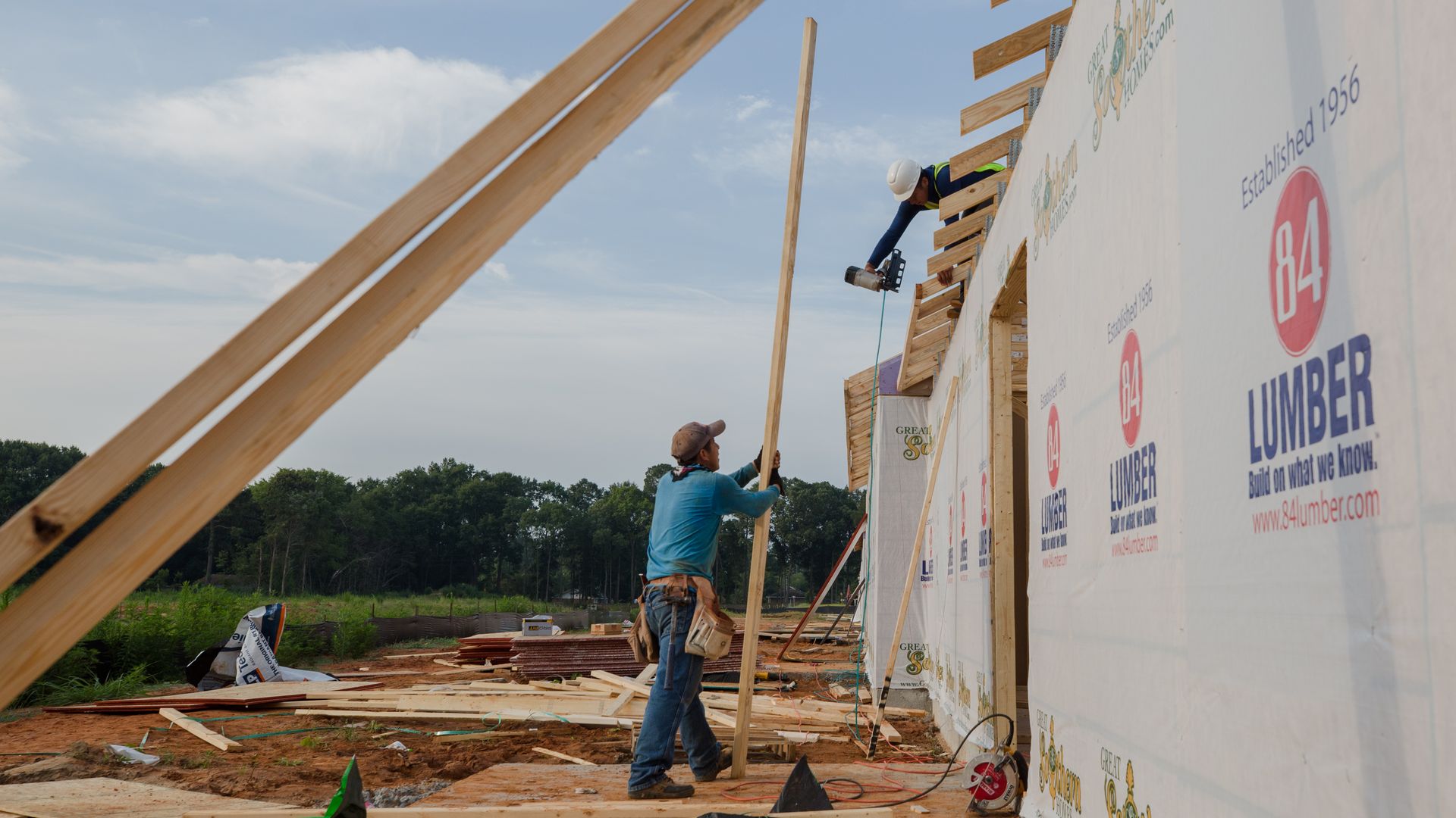 Contractors work on a home under construction in Sumter, South Carolina, U.S., on Tuesday, July 6, 2021. 