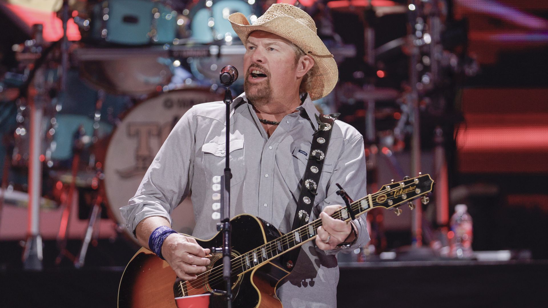 Toby Keith performs on stage.