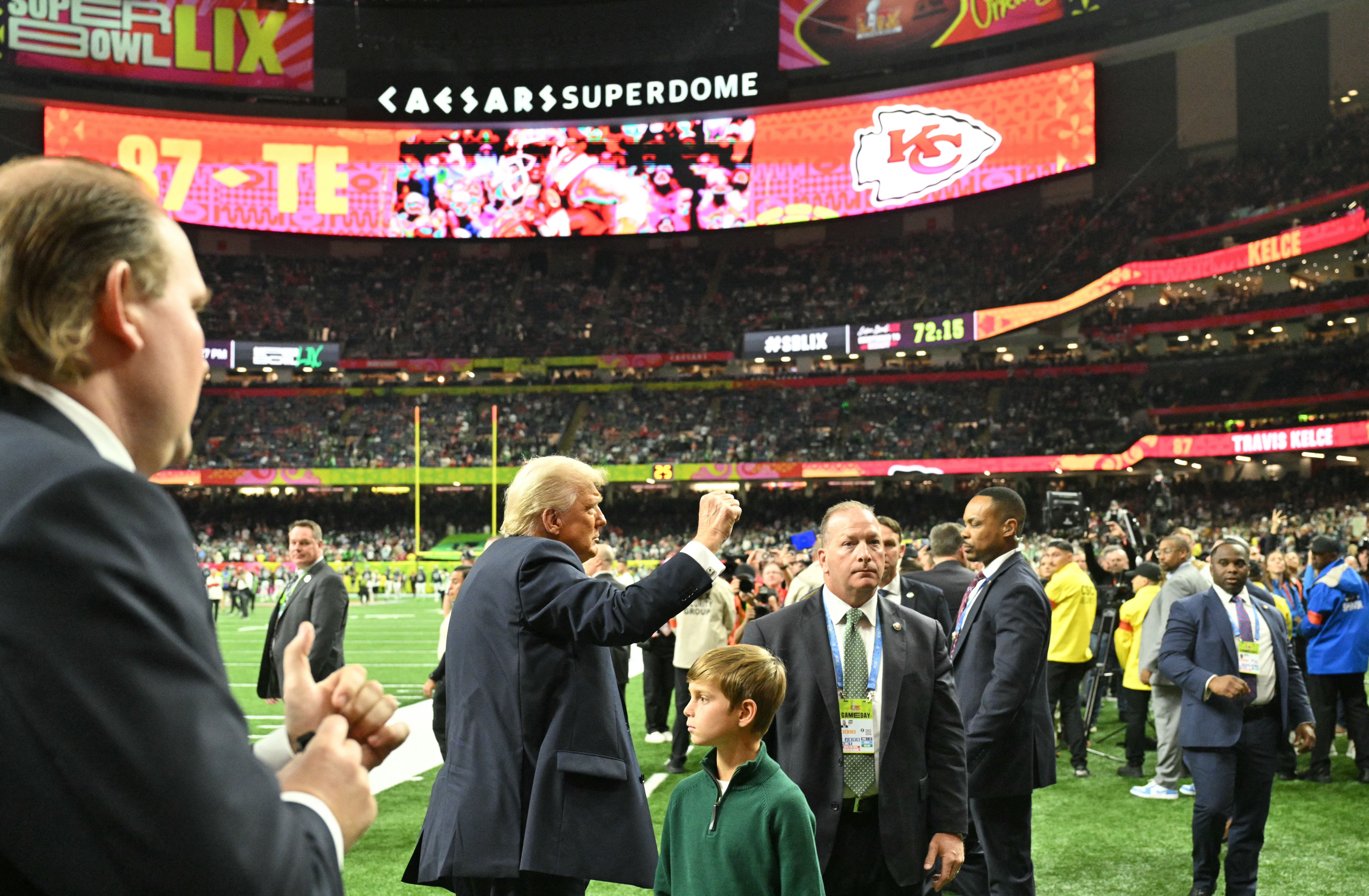Photo shows Trump on the field.