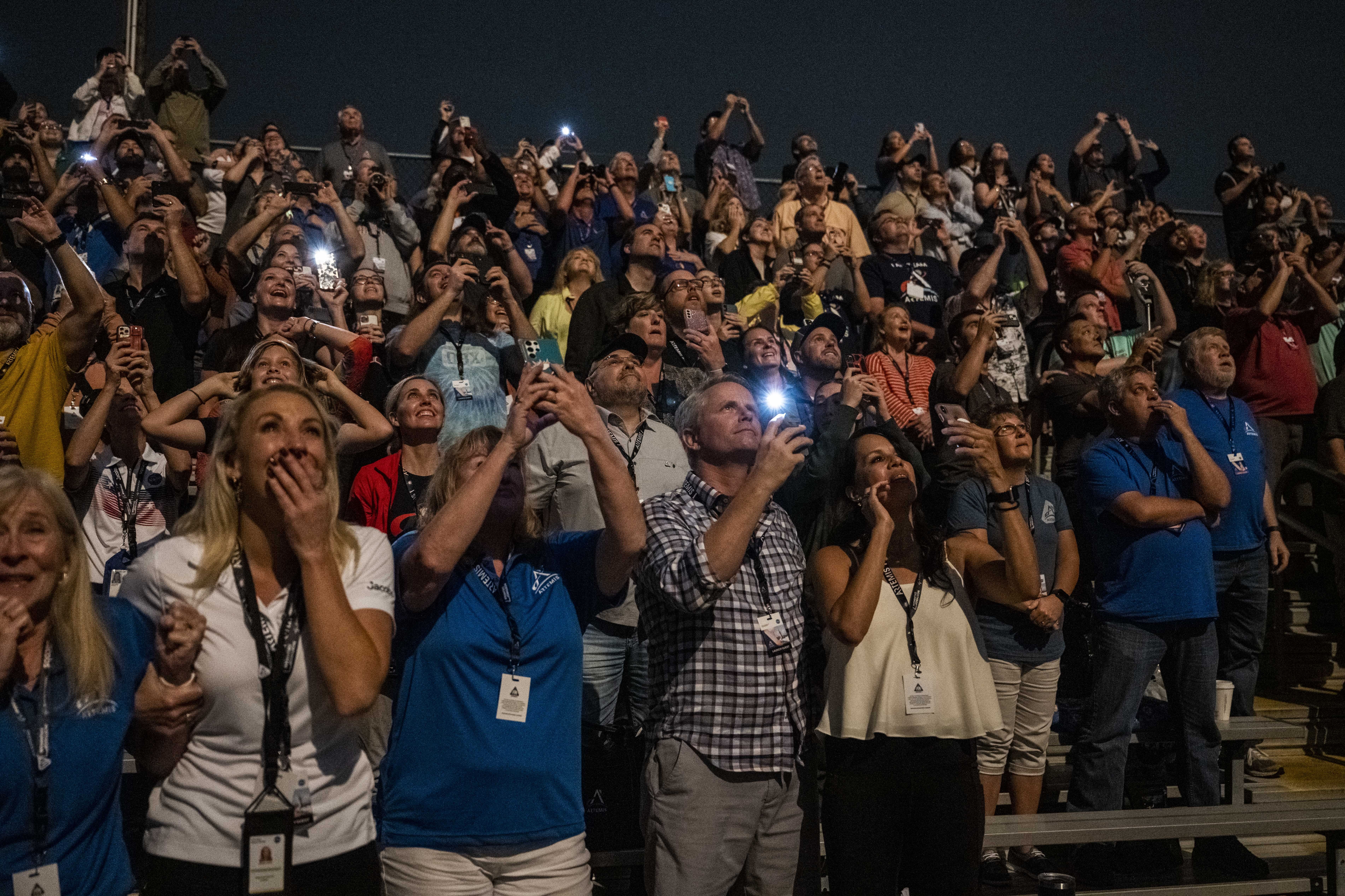 Photo of people watching the launch of NASA's new mission to the moon