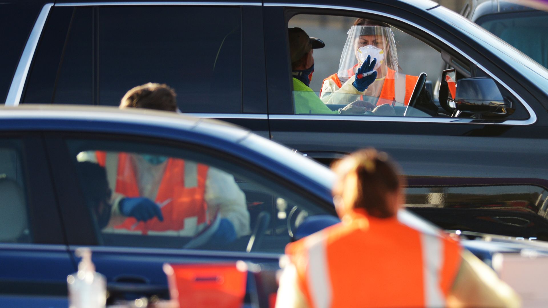 Healthcare workers collecting samples at a coronavirus testing site in Denver in November.