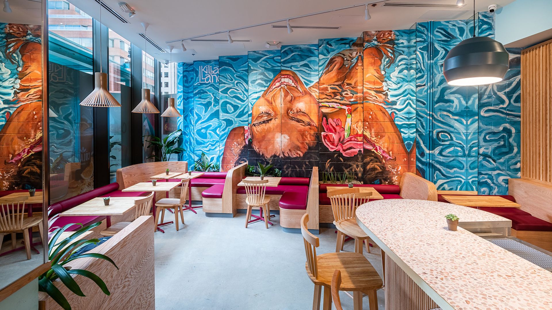 A coffee shop wall with a woman in a pool 