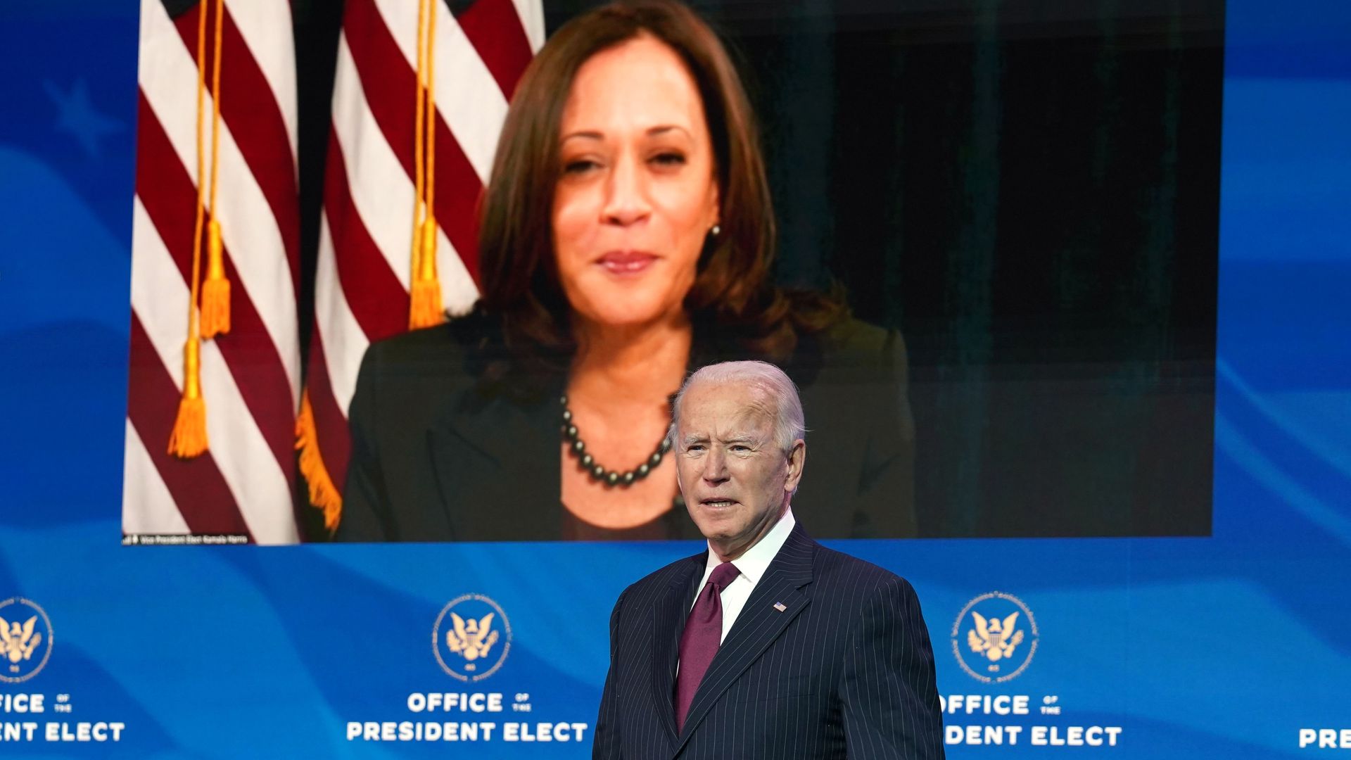 Vice President-elect Kamala Harris looks on as Joe Biden speaks in Delaware on Wednesday.