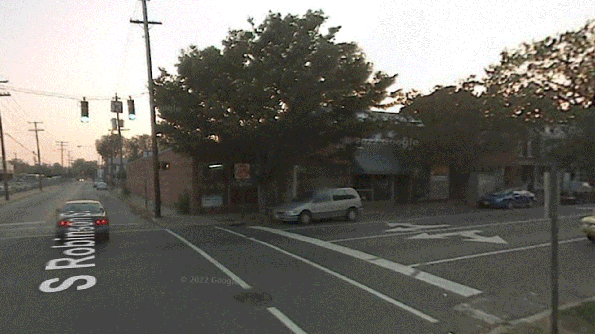 a series of images showing the corner of Robinson and Cary changing over time 