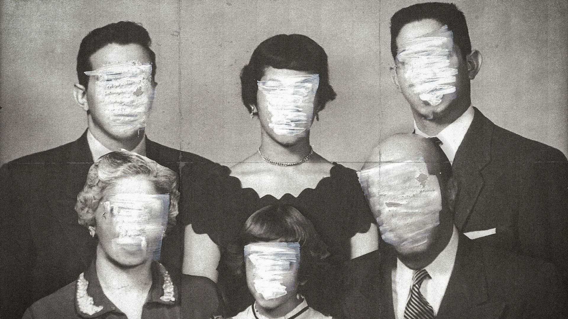 Photo illustration of a faded family portrait of an Arab American family with the faces marked out with a marker. 