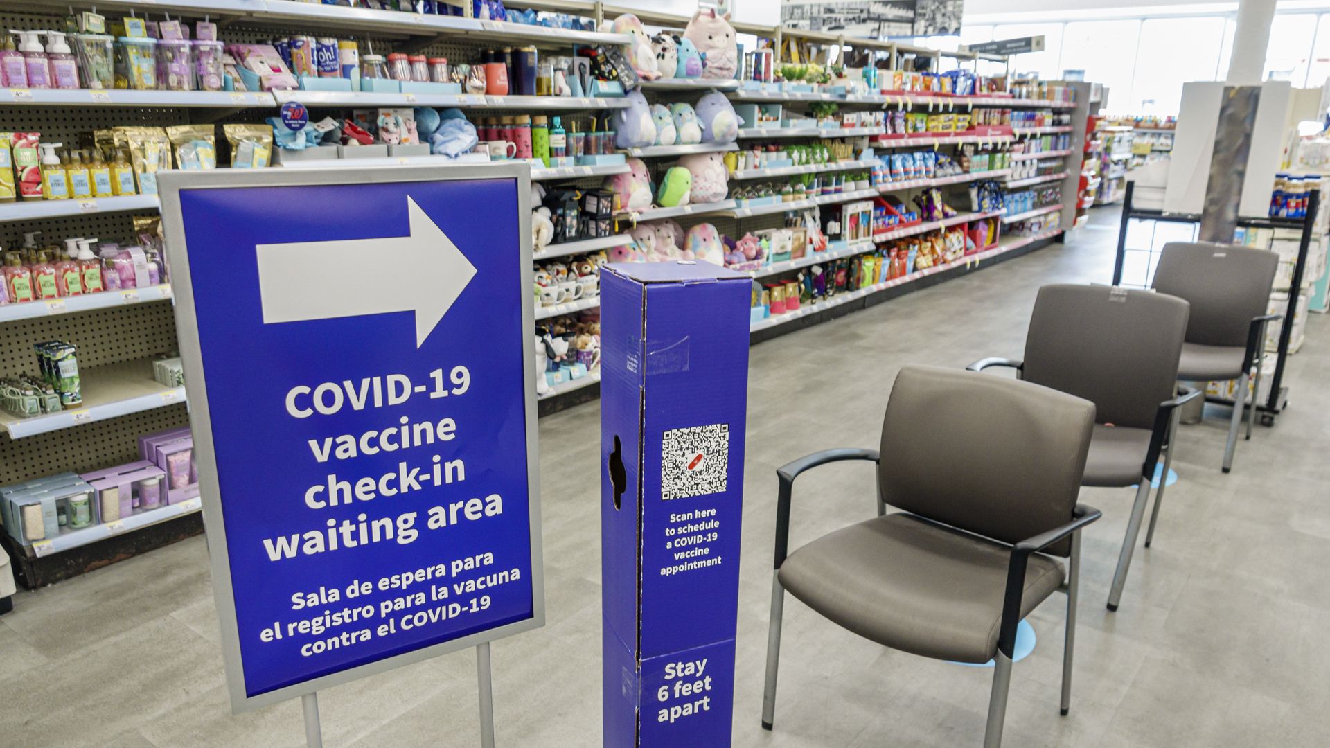 A COVID-19 vaccine check-in waiting area at a pharmacy.