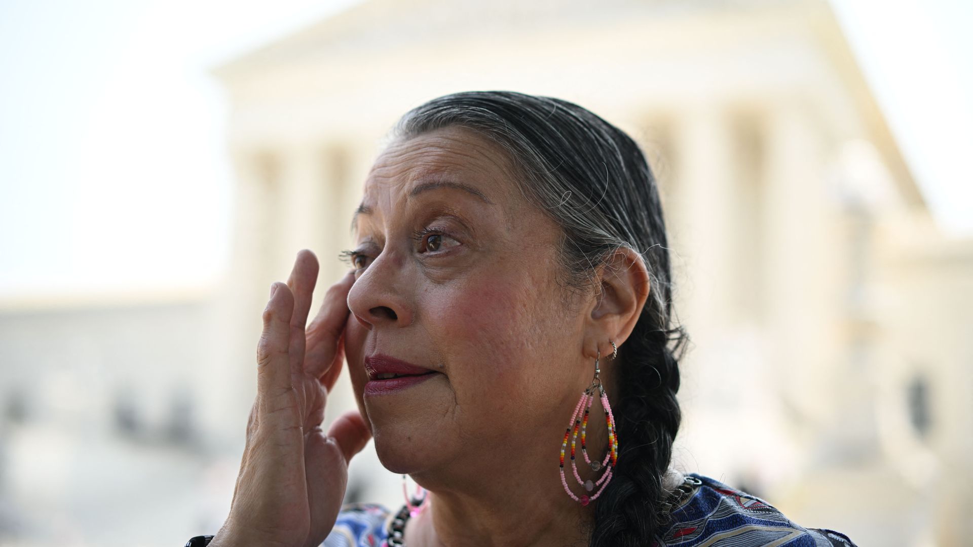 Alabama-Coushatta Tribe of Texas, Tribal Council Vice Chairperson, Nita Battise, wipes away tears outside the US Supreme Court in Washington, DC, on June 15, 2023.