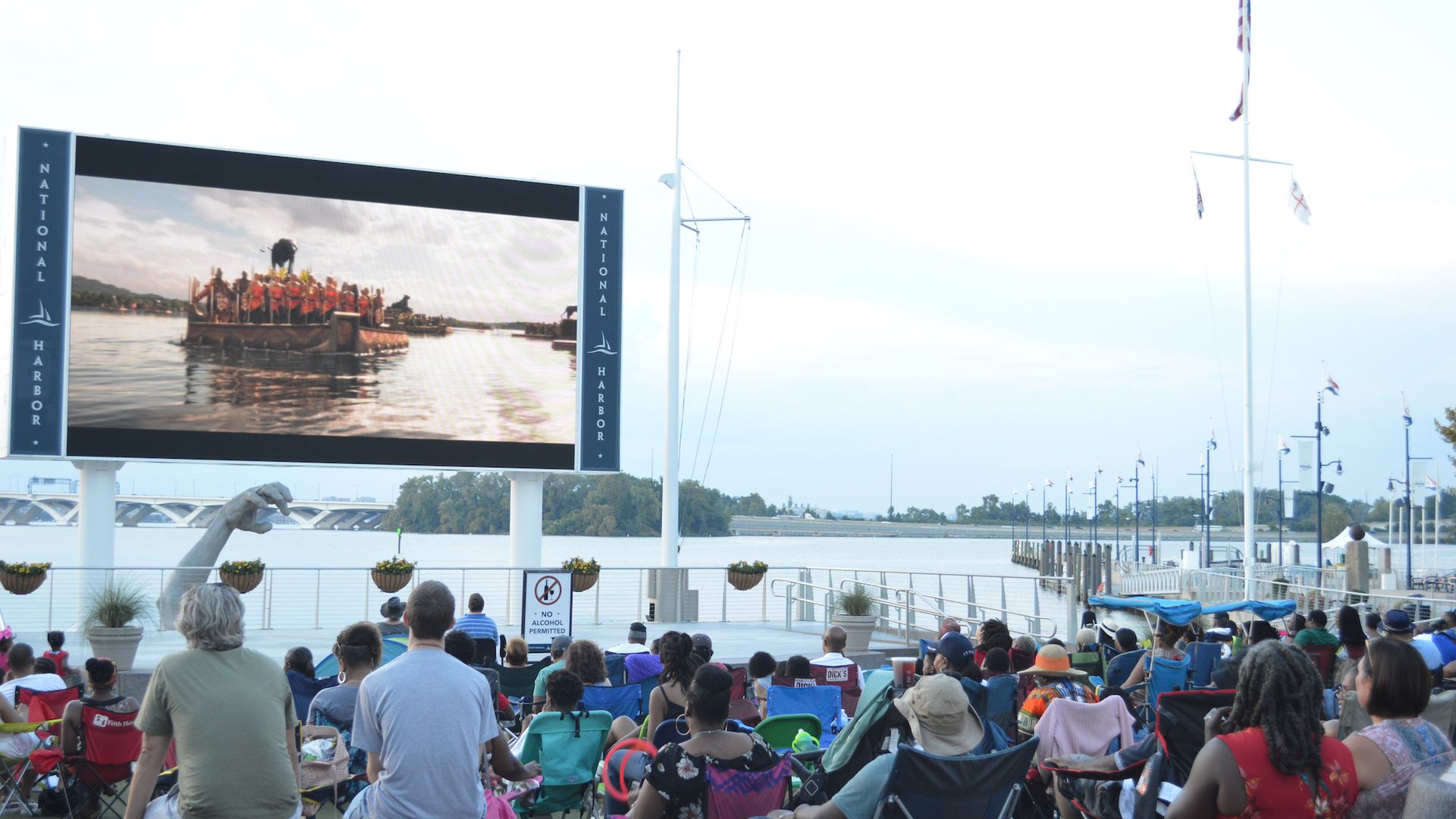 Movie-goers watch an outdoor screen at National Harbor 