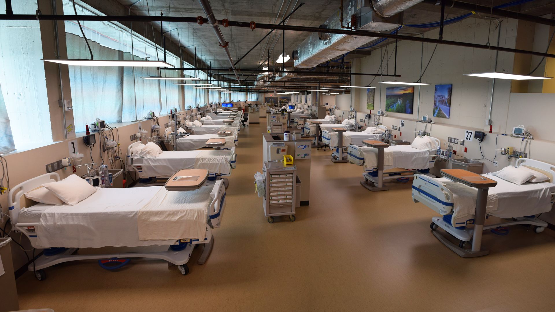 Rows of white beds and machines in a COVID-19 unit at a CoxHealth hospital.