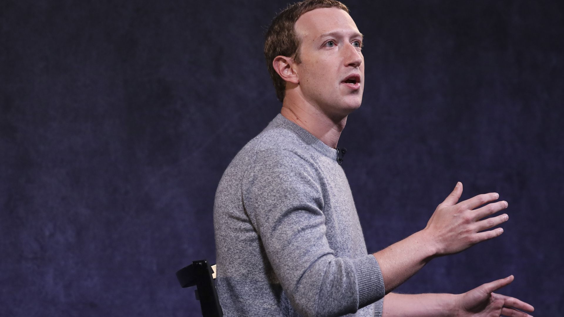 A photo of Facebook CEO Mark Zuckerberg giving a speech.