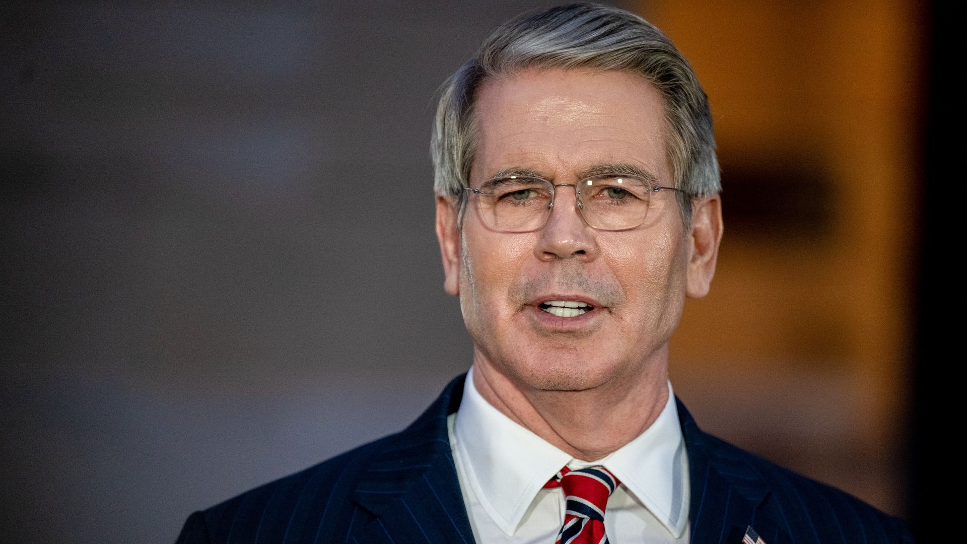 Scott Bessent in a white shirt and red tie