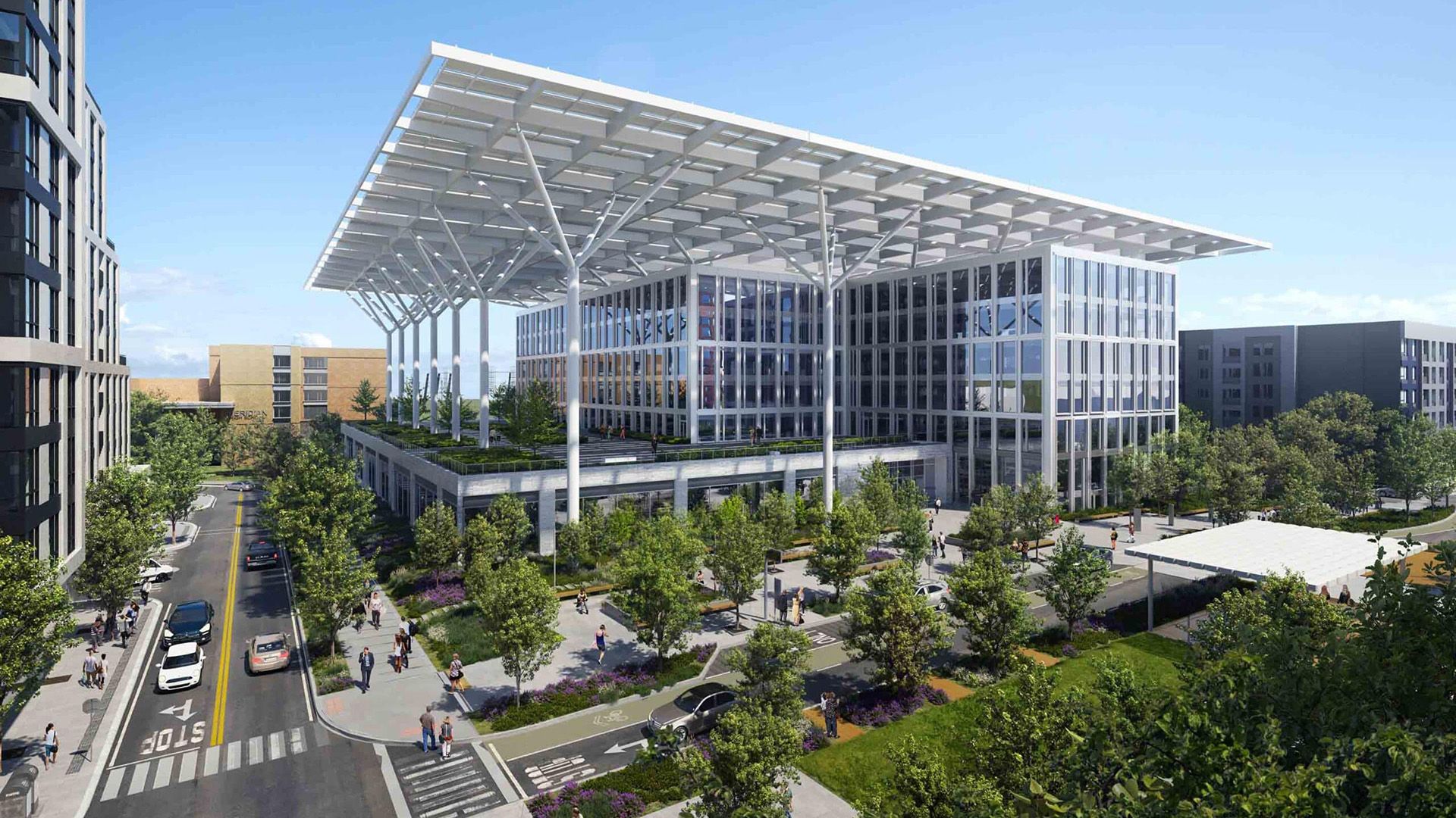 A modern glass office building with a large white cantilever roof supported by slim columns, set in a tree-filled urban plaza with pedestrians and cars on a sunny day.