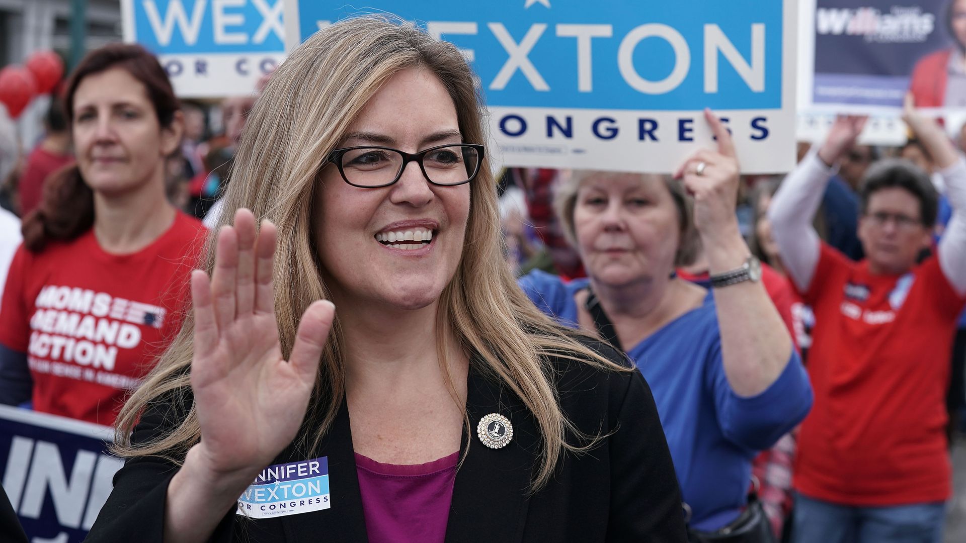 Democrat Jennifer Wexton waves in a sea of supporters 