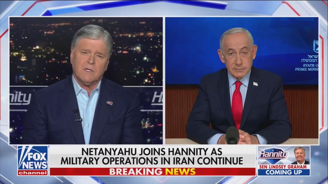 Fox News split-screen showing host Sean Hannity on left and Benjamin Netanyahu on right during a discussion about continuing military operations in Iran, with breaking news banner.