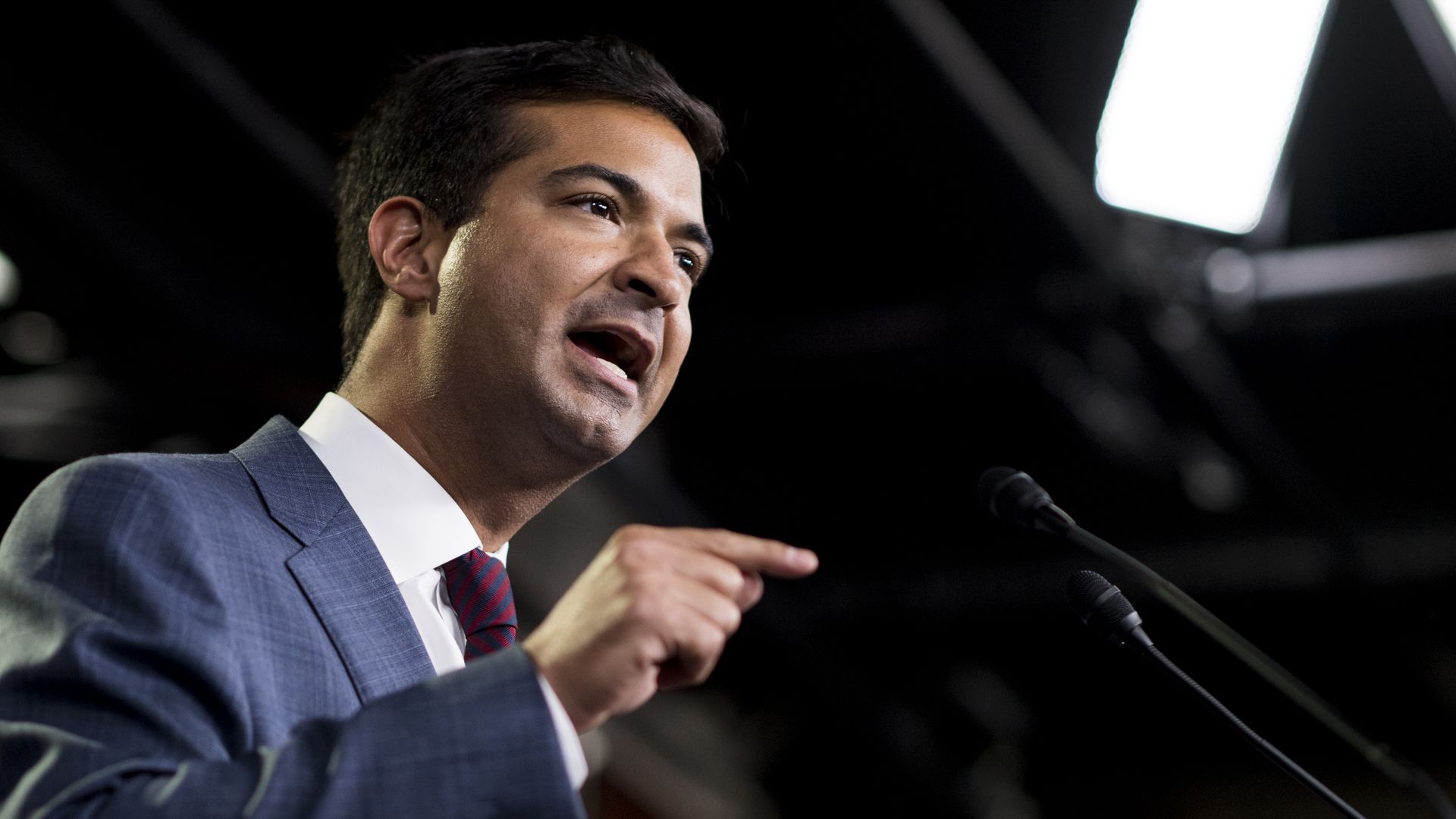 Carlos Curbelo speaking at a press conference.