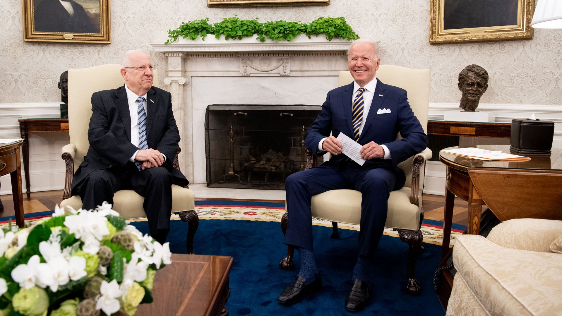 President Biden is seen sitting with Israeli President Reuven Rivlin in the Oval Office.