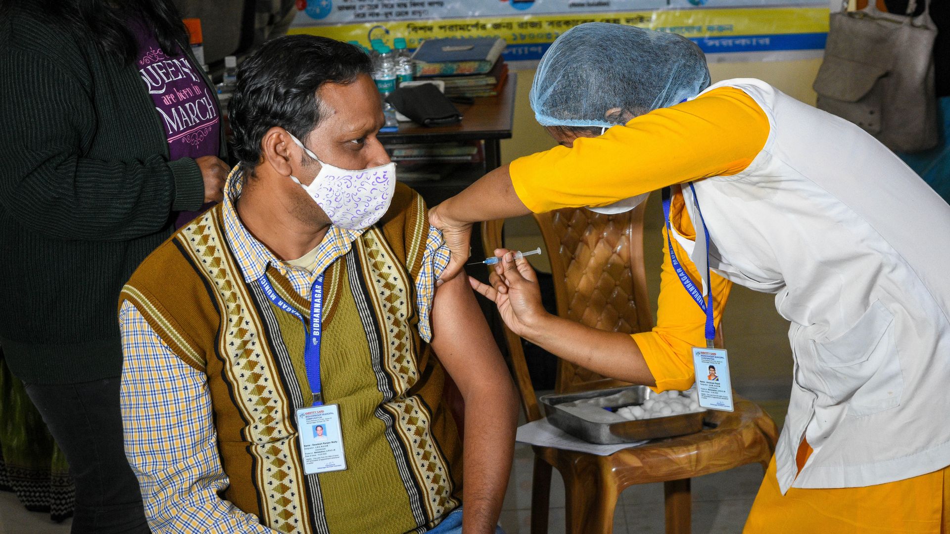 Picture of a health worker injecting a dry vaccine to a patient for a practice run for the astrazeneca vaccine