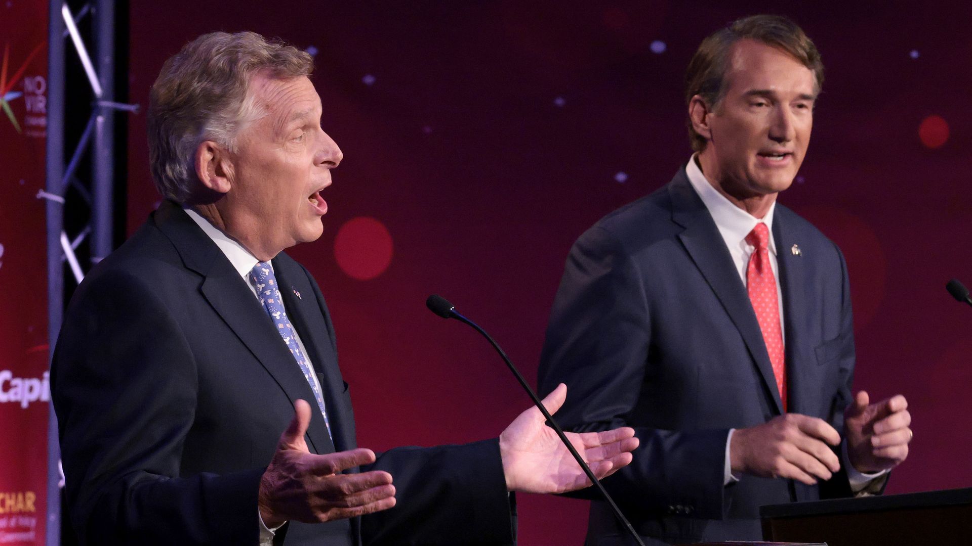 Terry McAuliffe and Glenn Youngkin are seen during a debate in September.