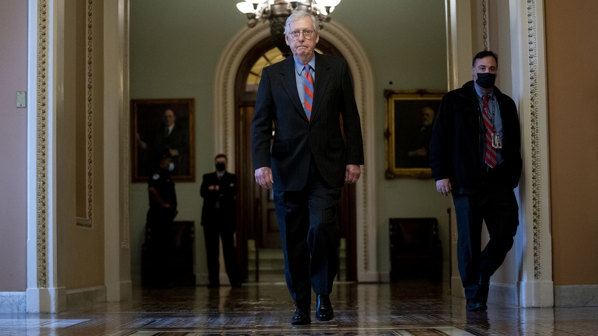 Senate Minority Leader Mitch McConnell is seen walking away from the chamber on Wednesday.