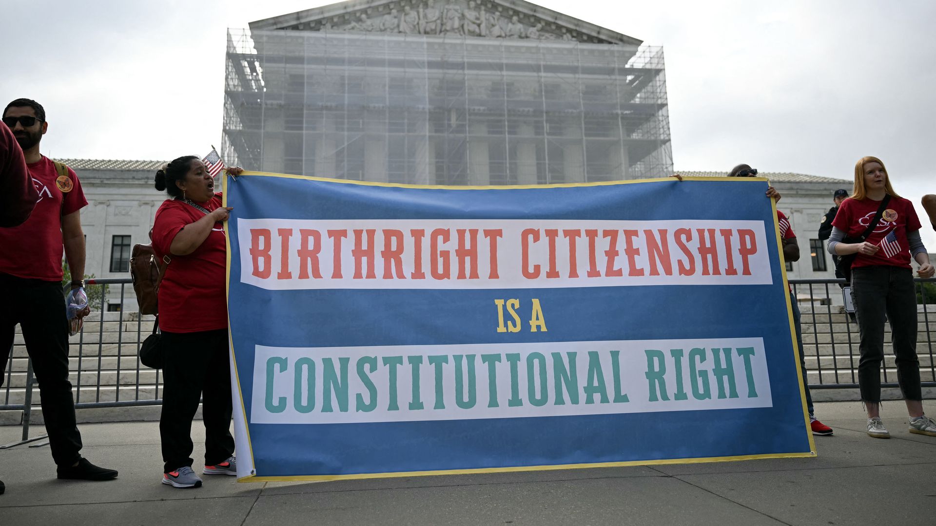 Protesters hold a banner outside the Supreme Court with the words "BIRTHRIGHT CITIZENSHIP IS A CONSTITUTIONAL RIGHT."