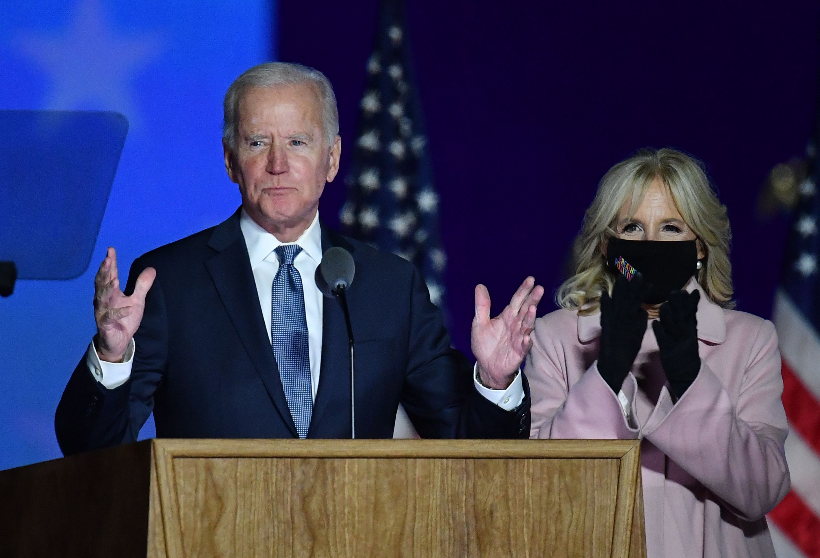 Democratic presidential nominee Joe Biden along with his wife Jill Biden speaks during election night at the Chase Center in Wilmington, Delaware, early on November 4