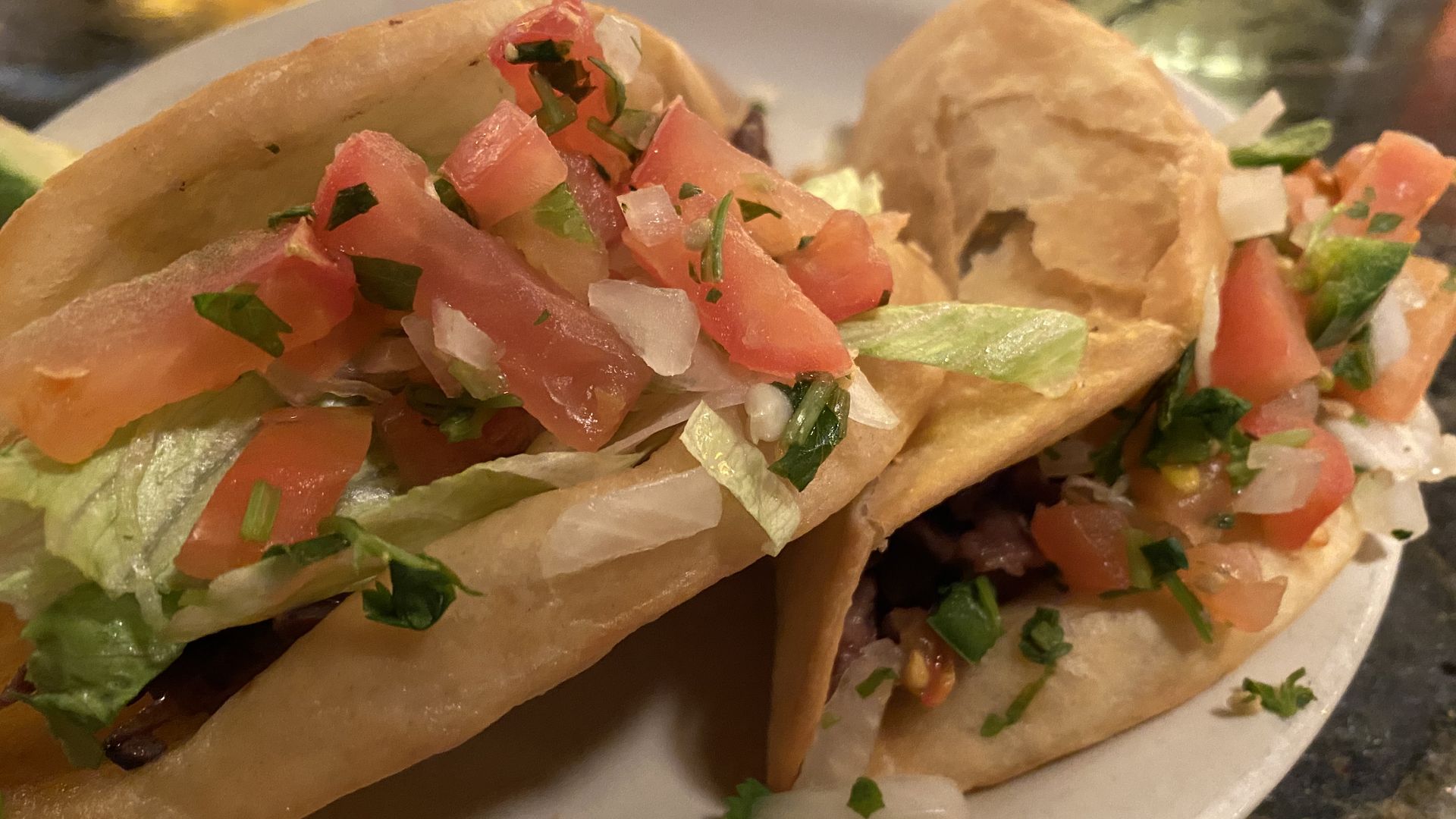 Two Desperados tacos, with crispy flour shells and lots of pico.