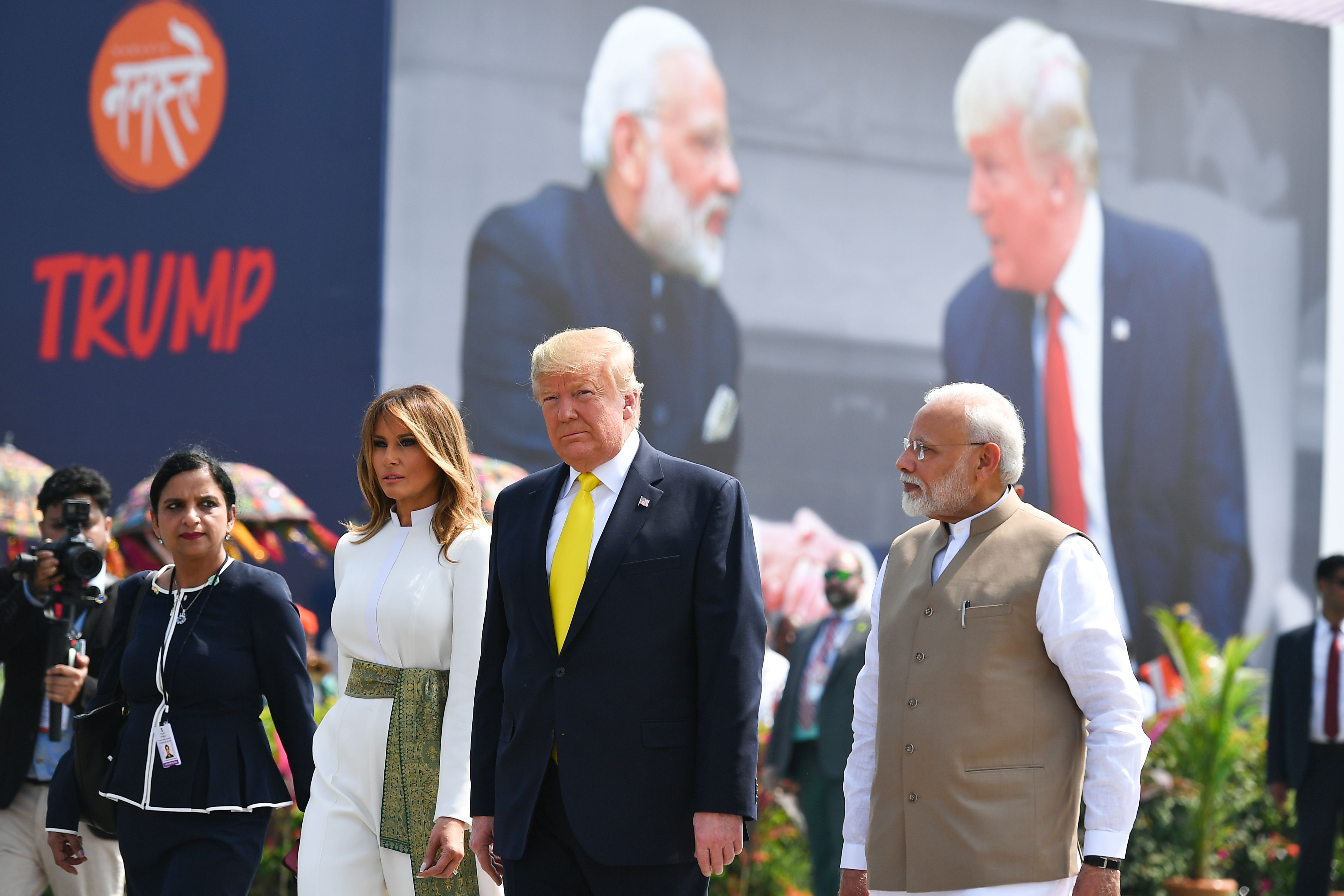 India's Prime Minister Narendra Modi (R) greets US President Donald Trump (C) and First Lady Melania Trump (2L) upon their arrival 