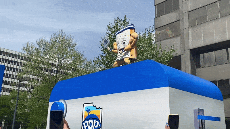 A Pop-Tarts mascot being lowered into a giant toaster and then smoke blown in the air. 