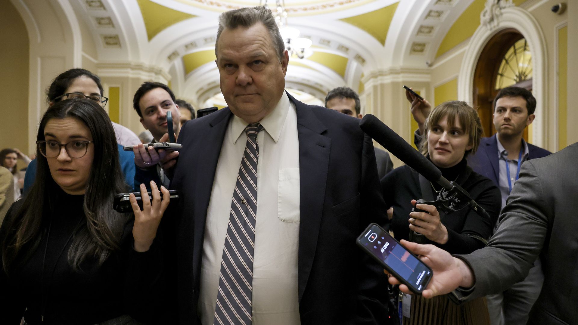 U.S. Sen. Jon Tester (D-MT) speaks to reporters as he walks through the Capitol Building on February 05, 2024 in Washington, DC.